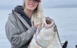 Abbi Hyder holding a Halibut