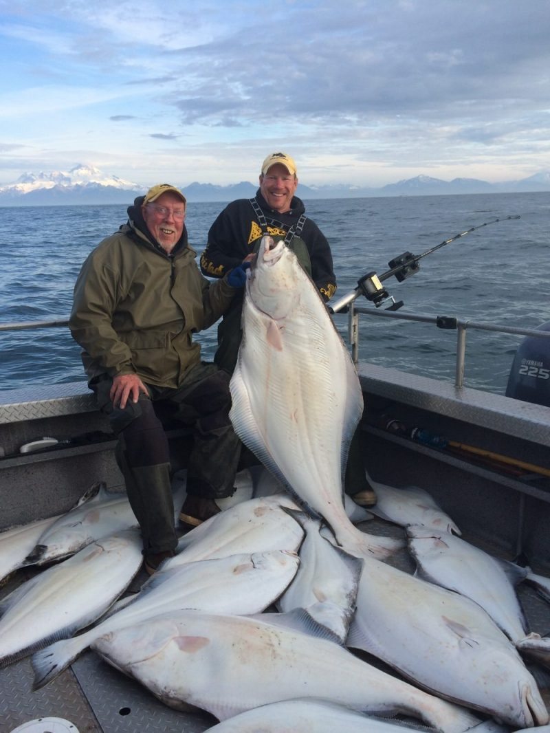 Jimmie and Big Jim posing with large halibut