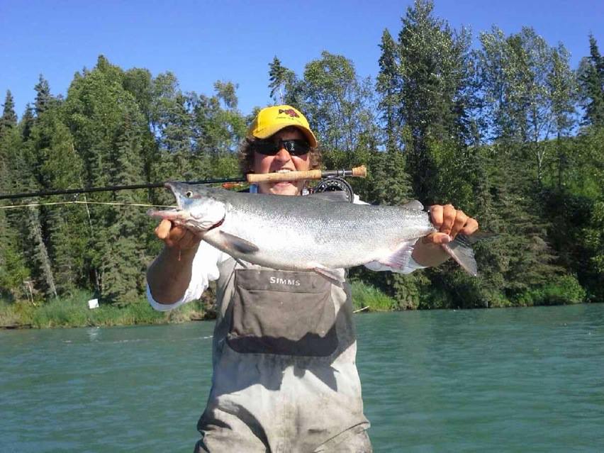 Guide holding a salmon