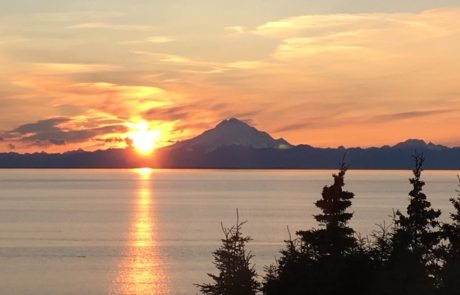 Sunset over Alaskan lake and mountain