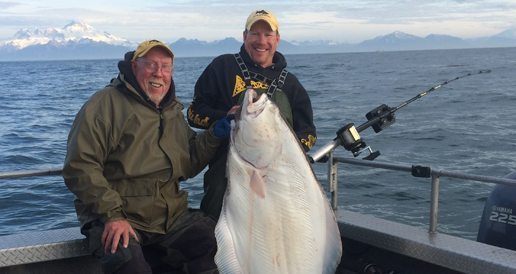 Jimmie Jack and Big Jim posing with large halibut