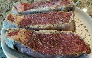 seasoned meat before it is cooked