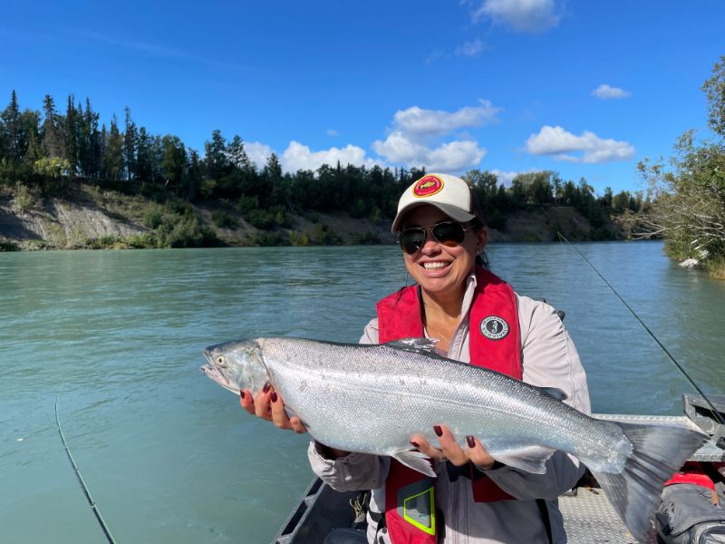 Rosy holding large silver salmon. "Kenai River Silver Salmon Fishing."