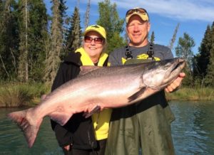An avid angler poses with Jimmie Jack, the ultimate Alaska fishing guide.