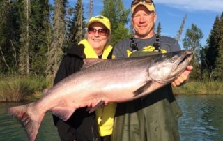 An avid angler poses with Jimmie Jack, the ultimate Alaska fishing guide.