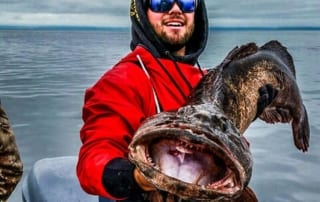 Man holding lingcod