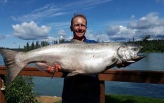 Man holding a monster salmon
