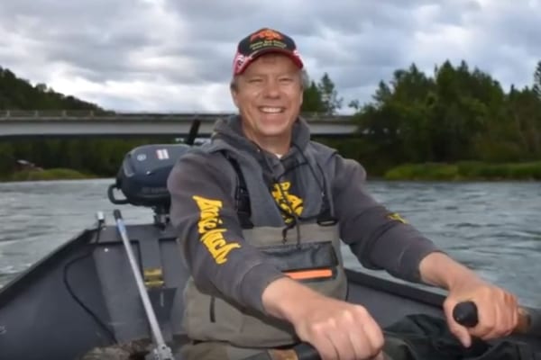 Scott Blahnik steering the boat