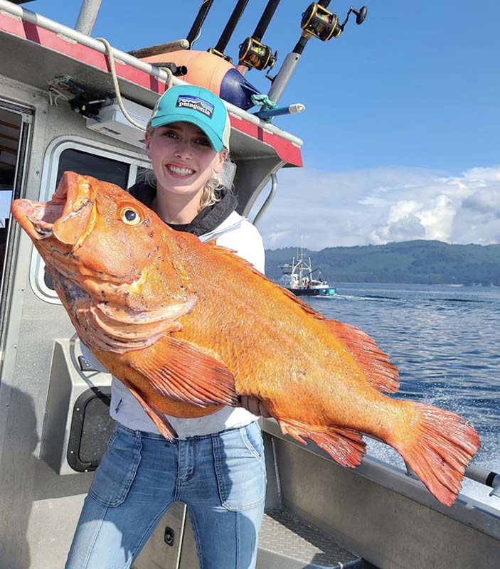Guest holding a rockfish.