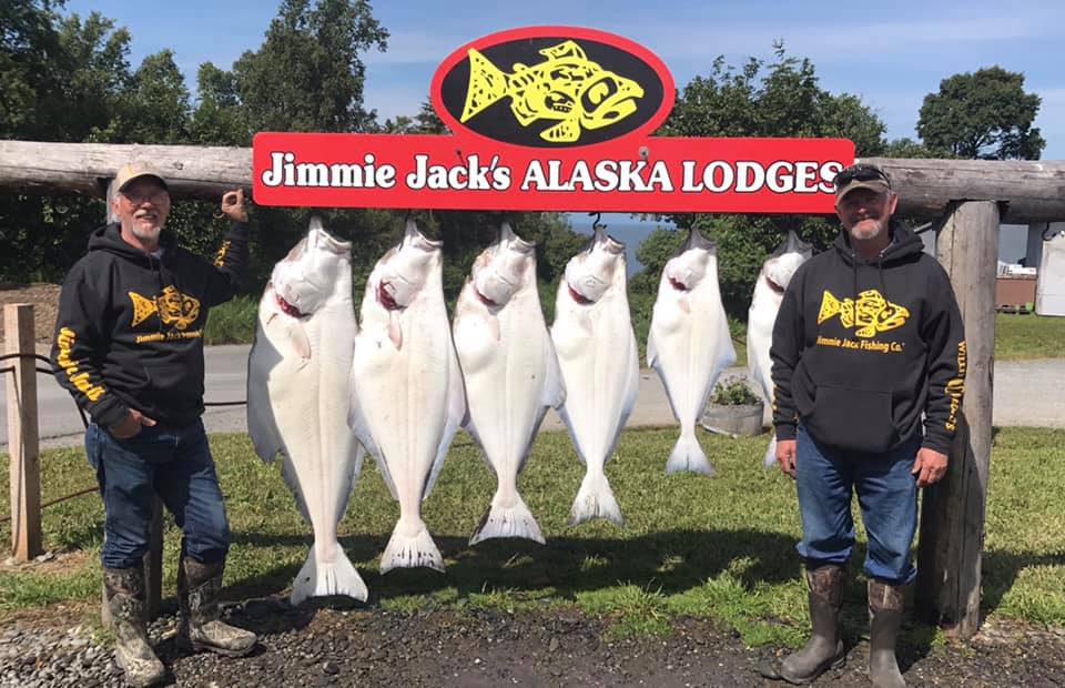 Guys standing by hanging halibut.