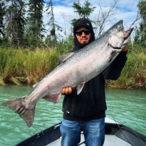 man holding a king salmon
