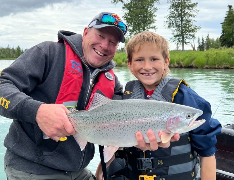 Jimmie Jack and boy holding rainbow trout