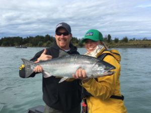 Jimmie Jack and woman holding a large salmon