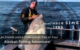 Halibut Charters Alaska: An angler struggles to hoist a massive halibut.