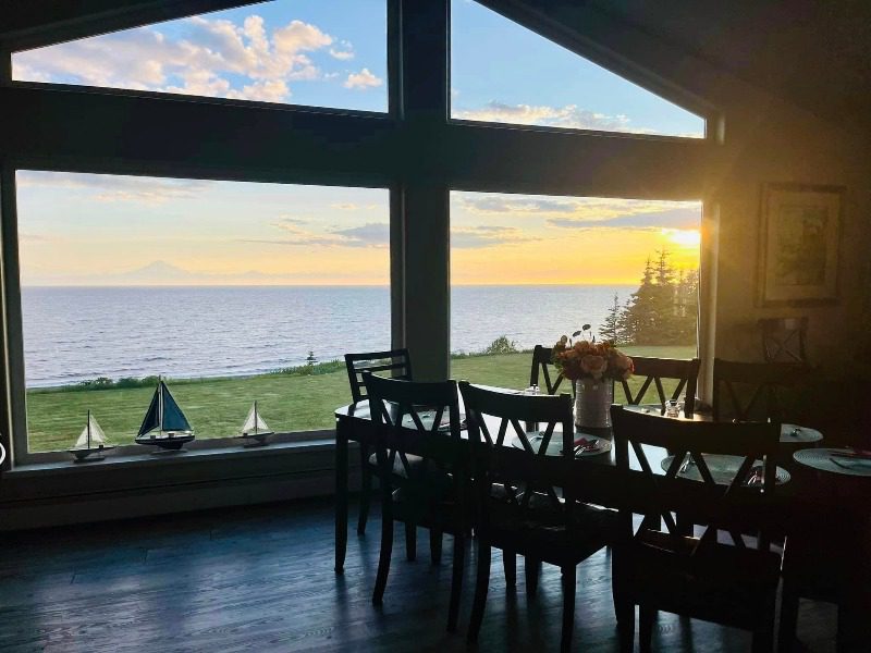 Alaska Luxury Fishing Lodge: An interior view of the Seascape Lodge from the perspective of looking out a window over the Cook Inlet.